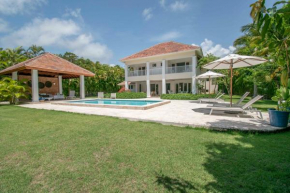 Colorful golf-front villa with private pool in exclusive beach resort